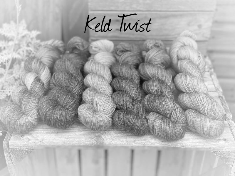 A black and white image of six skeins of yarn in different shades. "Keld Twist" is written at the top of the image.