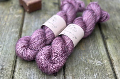 Two skeins of purple yarn 