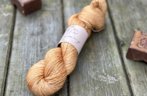 A skein of golden brown yarn