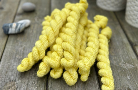 Yellow mini skeins of yarn