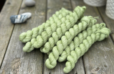 Green mini skeins of yarn