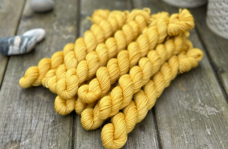 Rich yellow mini skeins of yarn
