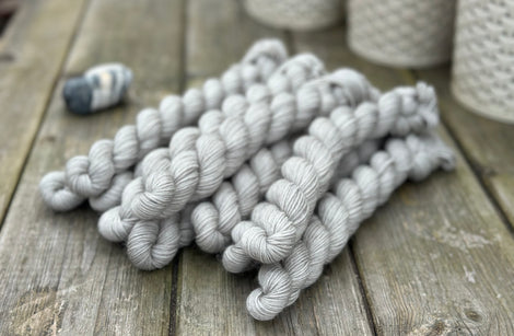 Grey mini skeins of yarn