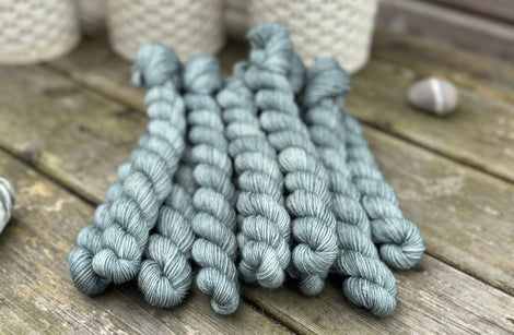 Blue-green mini skeins of yarn