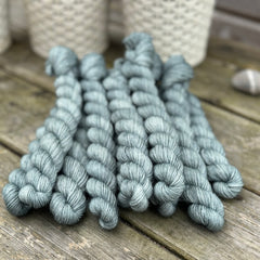Blue-green mini skeins of yarn