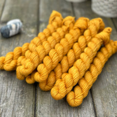 Dark orange mini skeins of yarn