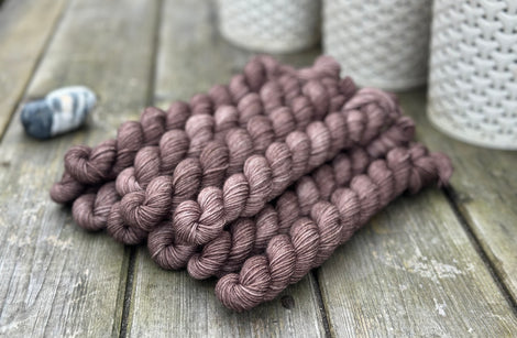 Dark brown mini skeins of yarn