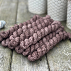 Dark brown mini skeins of yarn