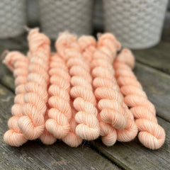 Peachy orange mini skeins of yarn