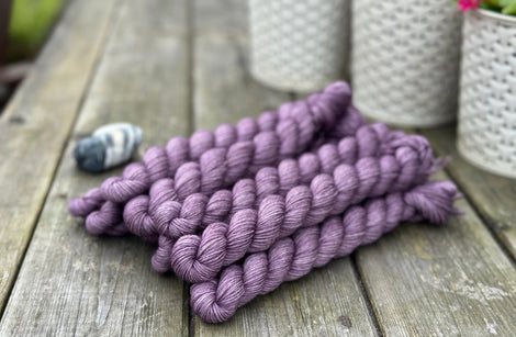 Purple mini skeins of yarn