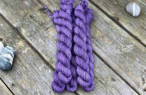 Rich purple mini skeins of yarn