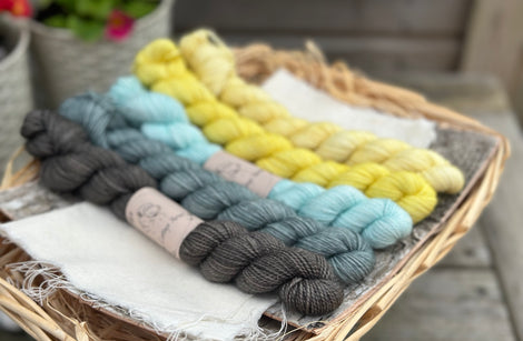 Five mini skeins in shades of blue and yellow