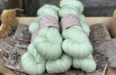 Five skeins of pale green yarn