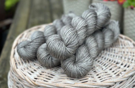 Four skeins of grey yarn