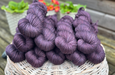 Skeins of dark purple yarn
