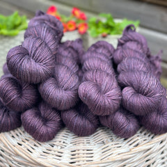 Skeins of dark purple yarn