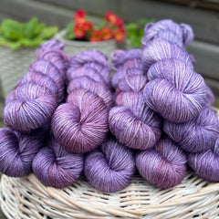 Skeins of variegated purple yarn