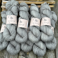 Nine skeins of grey yarn