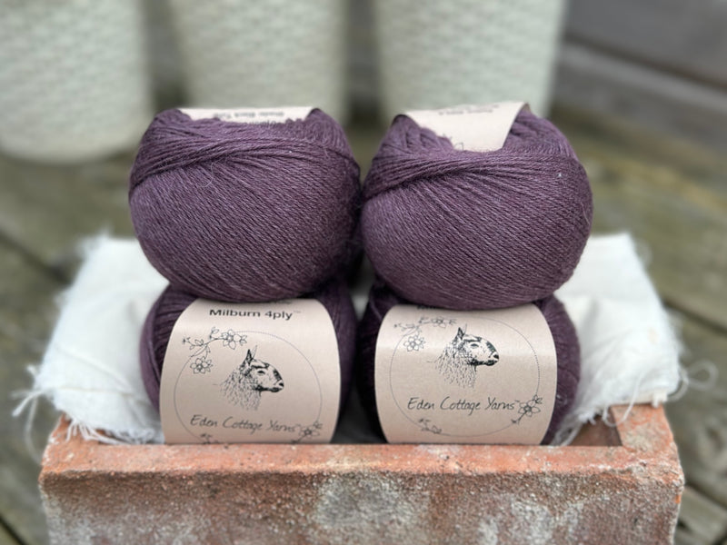 Balls of dark purple yarn