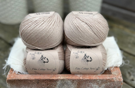 Balls of beige yarn