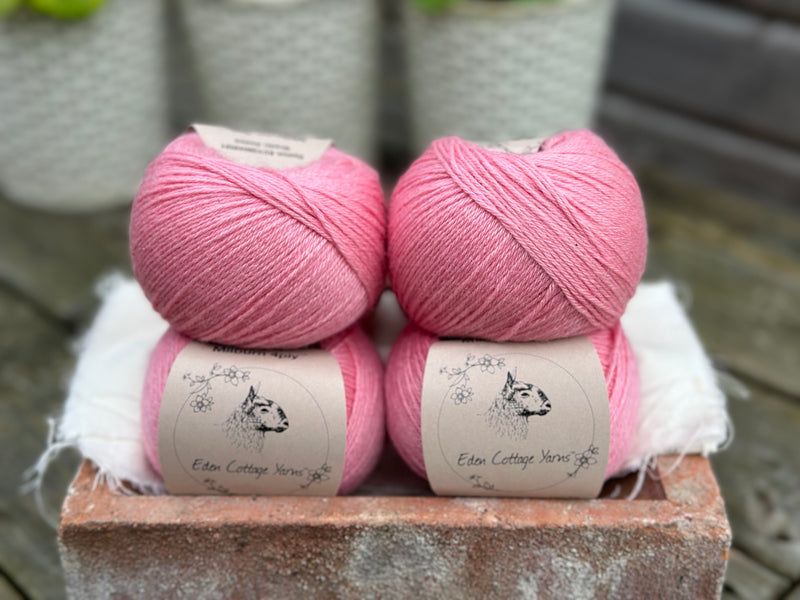 Balls of bright pink yarn