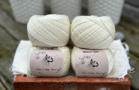 Balls of natural cream coloured yarn