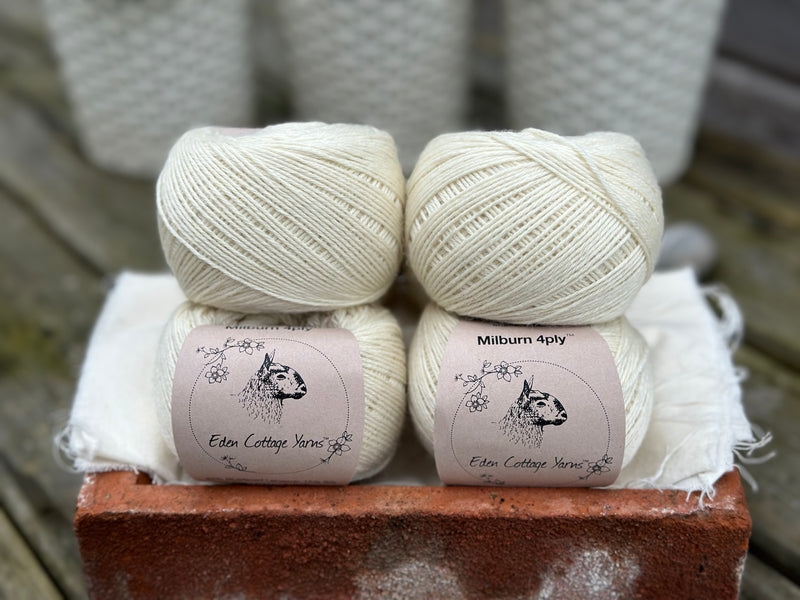 Balls of natural cream coloured yarn
