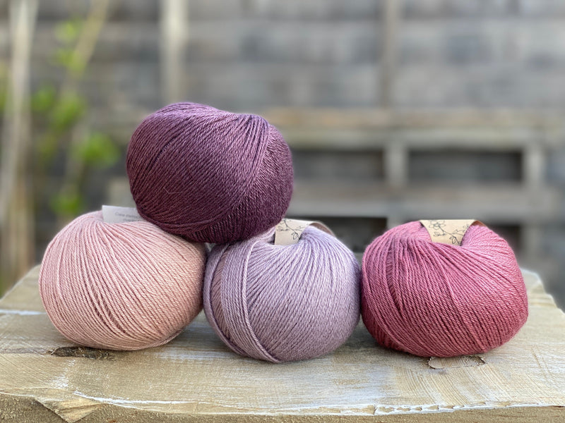Four balls of Milburn in shades of pink and purple
