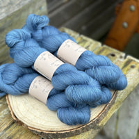 Five skeins of blue yarn