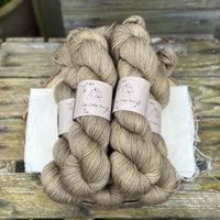 Five skeins of yellowy brown yarn