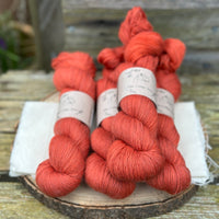 Five skeins of red yarn