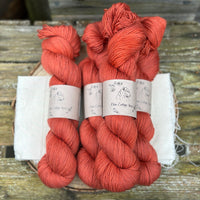 Five skeins of red yarn