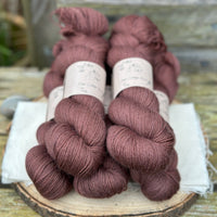 Five skeins of rich brown yarn