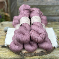 Fives skeins of purple yarn