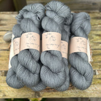 Six skeins of blue grey yarn