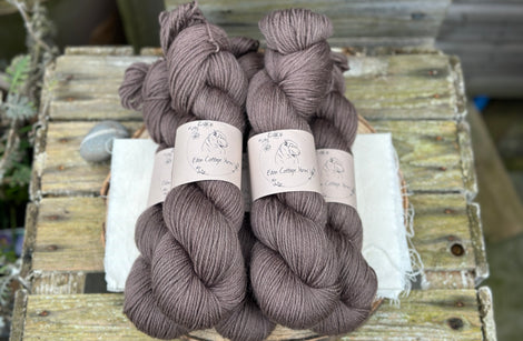 Five skeins of dark brown yarn