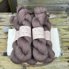 Five skeins of dark brown yarn