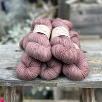 Five skeins of rosy brown yarn