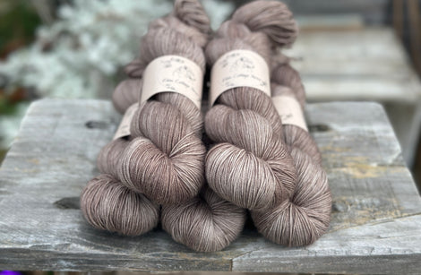 Five skeins of mid-brown yarn