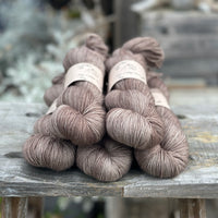 Five skeins of mid-brown yarn