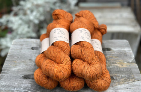 Five skeins of orangey brown yarn