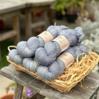 Five skeins of grey-blue yarn