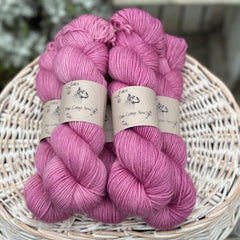 Five skeins of pinky purple yarn