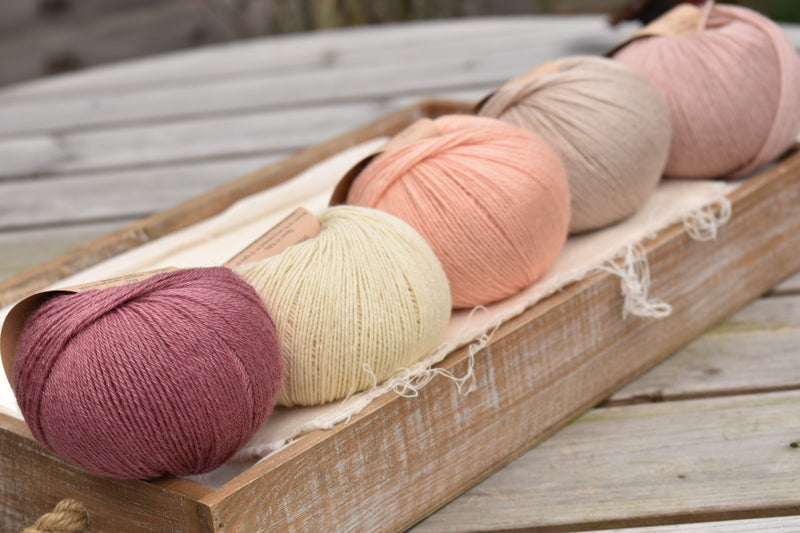 Five balls of Milburn in shades of pink, cream and beige