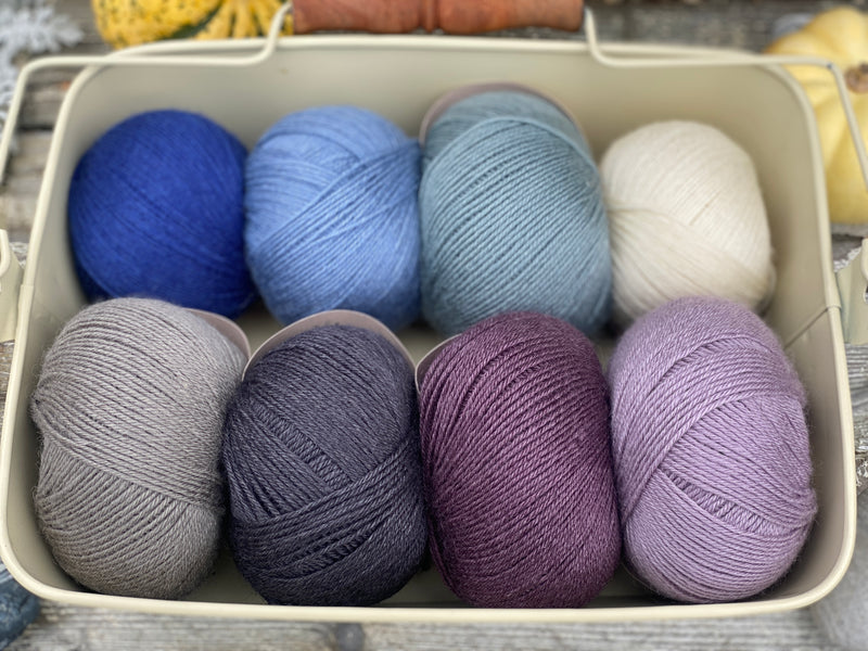 Eight balls of Milburn 4ply in shades of blue and purple