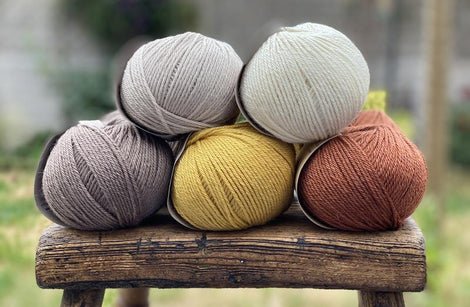 Ten balls of Milburn in shades of cream, beige, brown and yellow