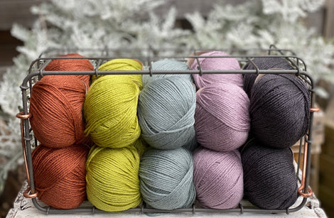 Twenty balls of Milburn in shades of rust, green, purple and grey
