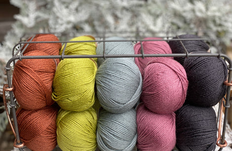 Twenty balls of Milburn in shades of rust, green, grey and pink