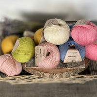 Yarns for the Floral Mandala Shawl. Milburn DK in shades of pink, cream, blue, green and yellow