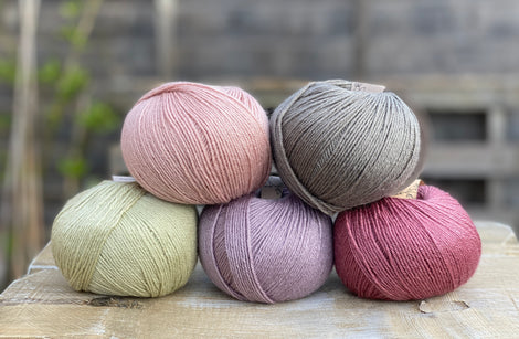 Five balls of Milburn in pink, purple, grey and green